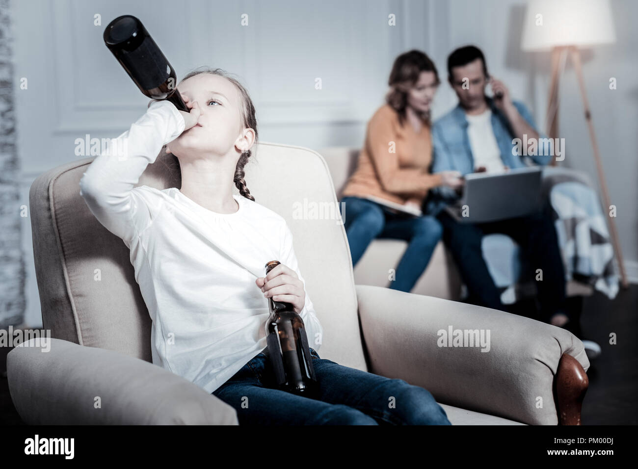 Lonely kid drinking beer Stock Photo Alamy