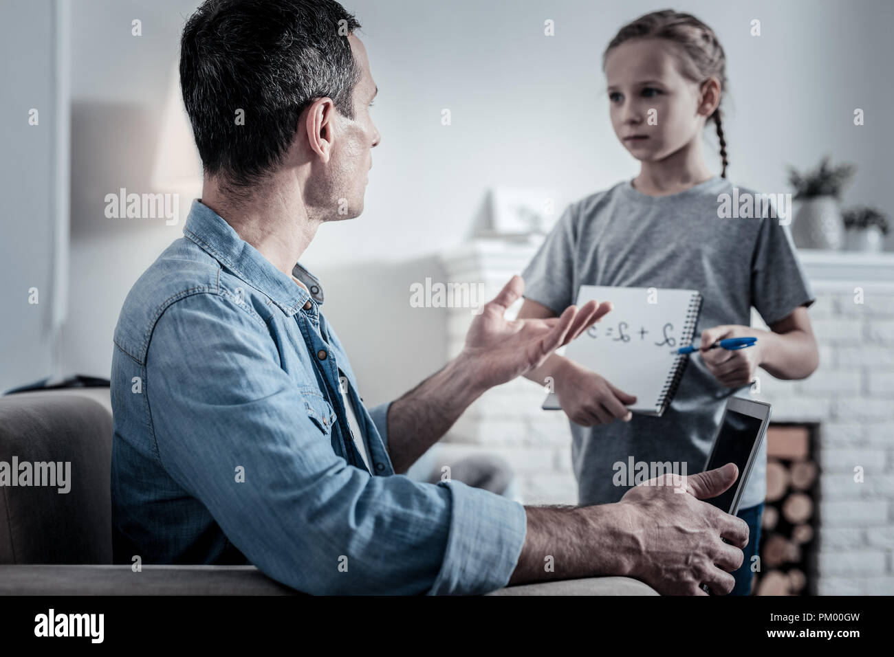 Nervous man critisizing the daughter Stock Photo