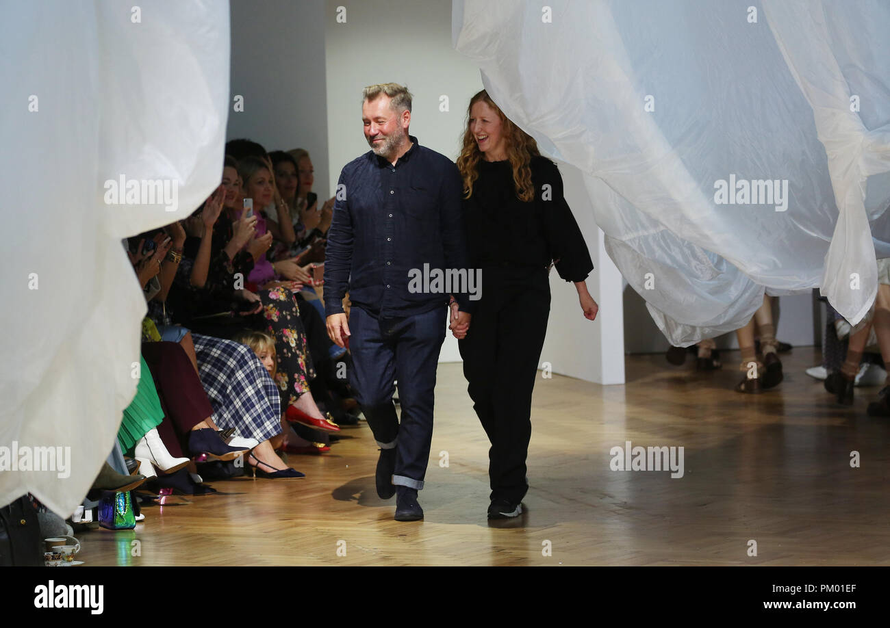Designers Justin Thornton and Thea Bregazzi acknowledge the audience after their catwalk during the Preen by Thornton Bregazzi London Fashion Week September 2018 show at Lindley Hall, London Stock Photo