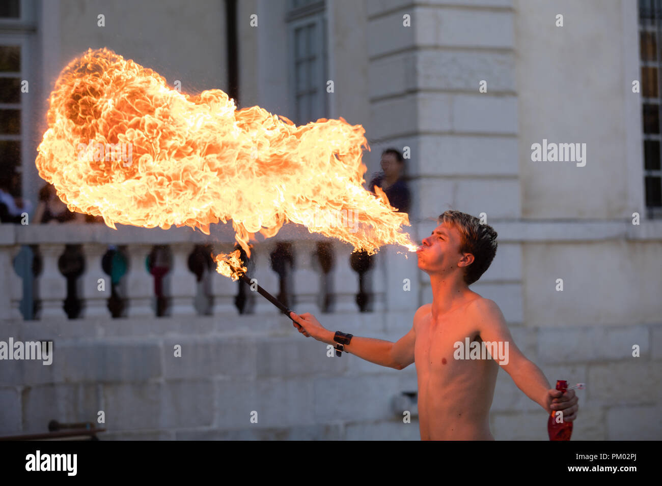 Sassenage castle, Isere, France - September 15 2018 : European Heritage Day, Young fire breather spitting flames. Stock Photo