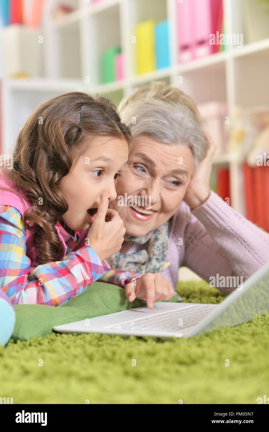 Portrait of grandmother and daughter using laptop Stock Photo - Alamy