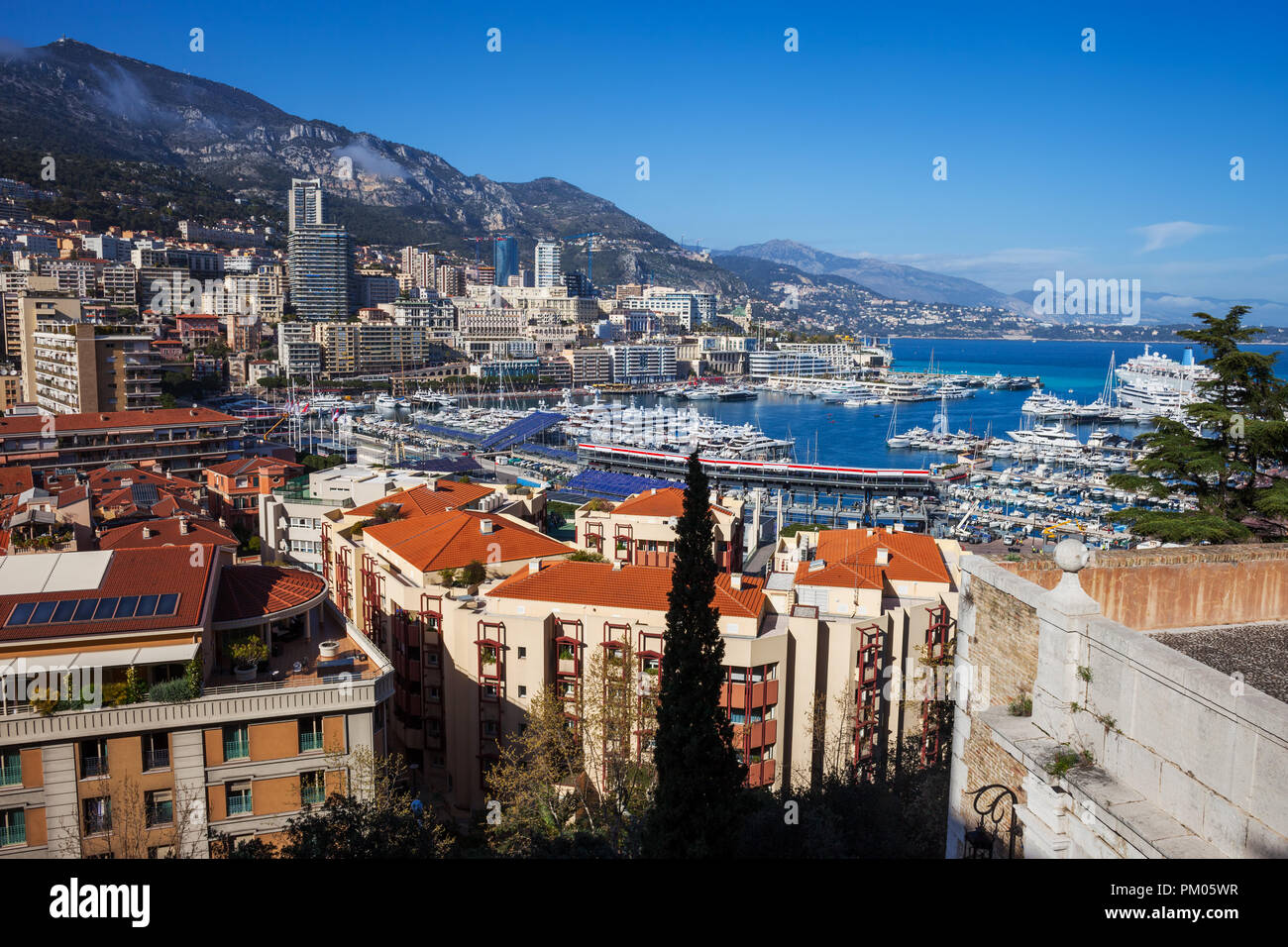 Principality of Monaco cityscape, view to Monte Carlo and Port Hercule on Mediterranean Sea Stock Photo