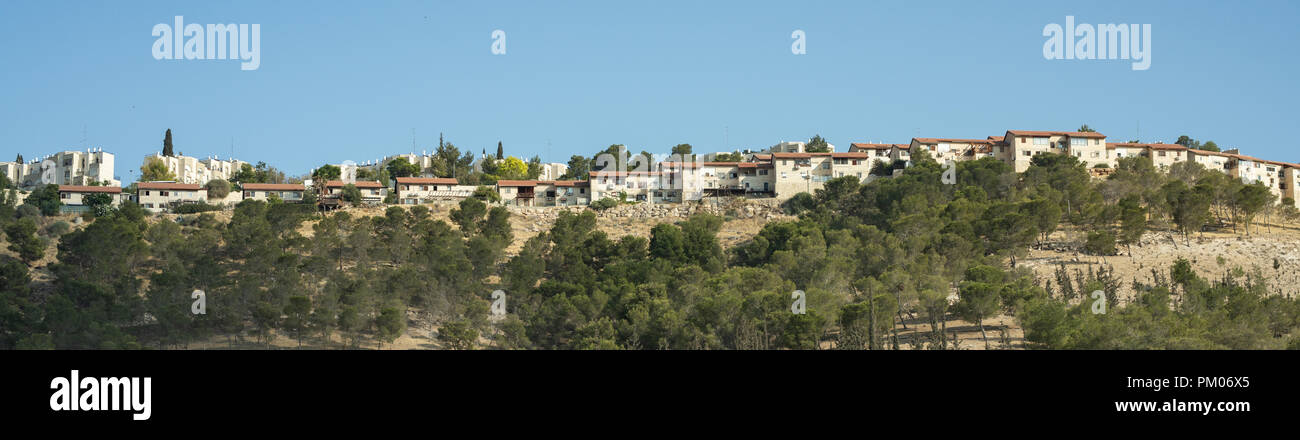 Jerusalem houses on the hill shot from below the road level Stock Photo