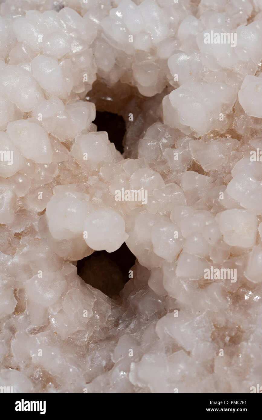 Funny close up of salt crystal with two wholes looking like eyes. Stock Photo