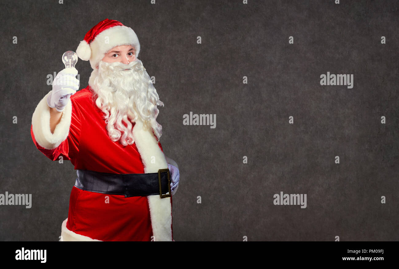 Santa Claus with a a  lamp on a Christmas. Stock Photo