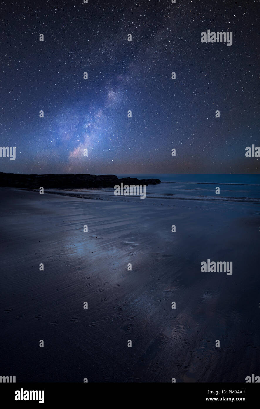 Stunning vibrant Milky Way composite image over landscape of empty ...