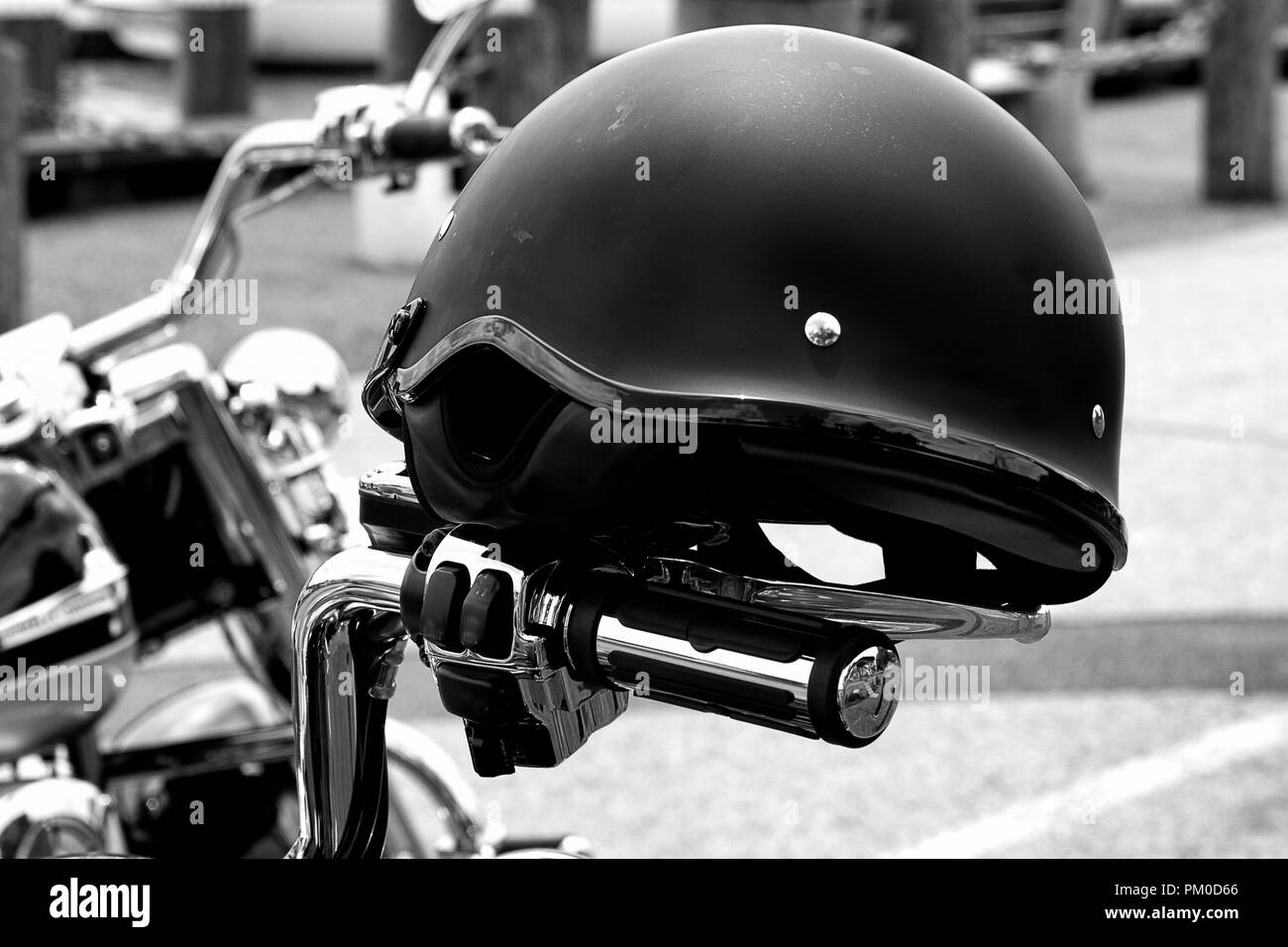 Closeup of motorcycle headlights, helmet in black and white Stock Photo