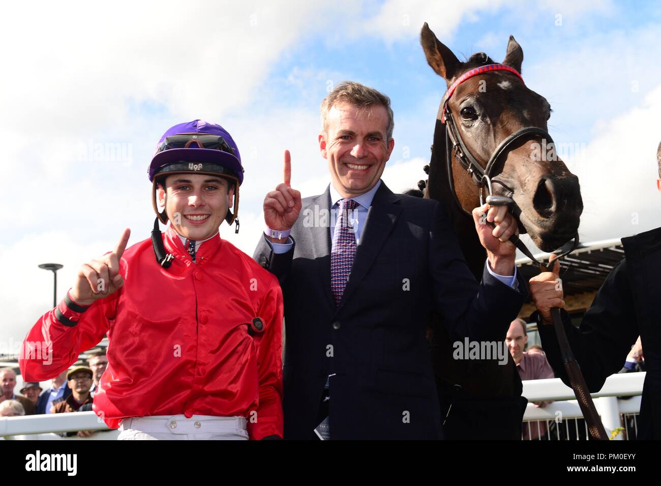 Jockey Ronan Whelan (left) celebrates winning the Moyglare Stud Stakes on Skitter Scatter alongside trainer Patrick Prendergast during day two of the 2018 Longines Irish Champions Weekend at Curragh racecourse County Neath. Stock Photo