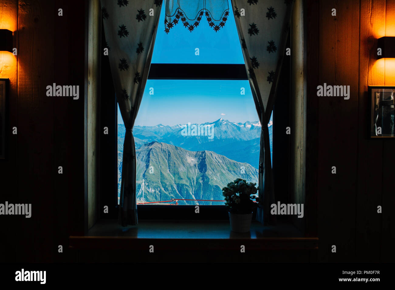 view through the window alpine hut, mountain landscapes, Italian Alps Stock Photo