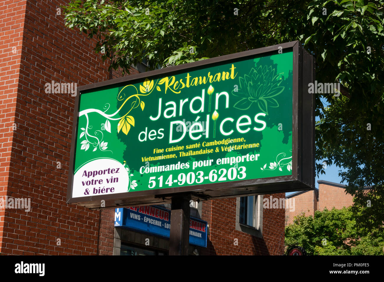 Sign outside Jardin des Delices Restaurant near the Olympic Stadium in Montreal, serving Southeast Asian cuisine Stock Photo