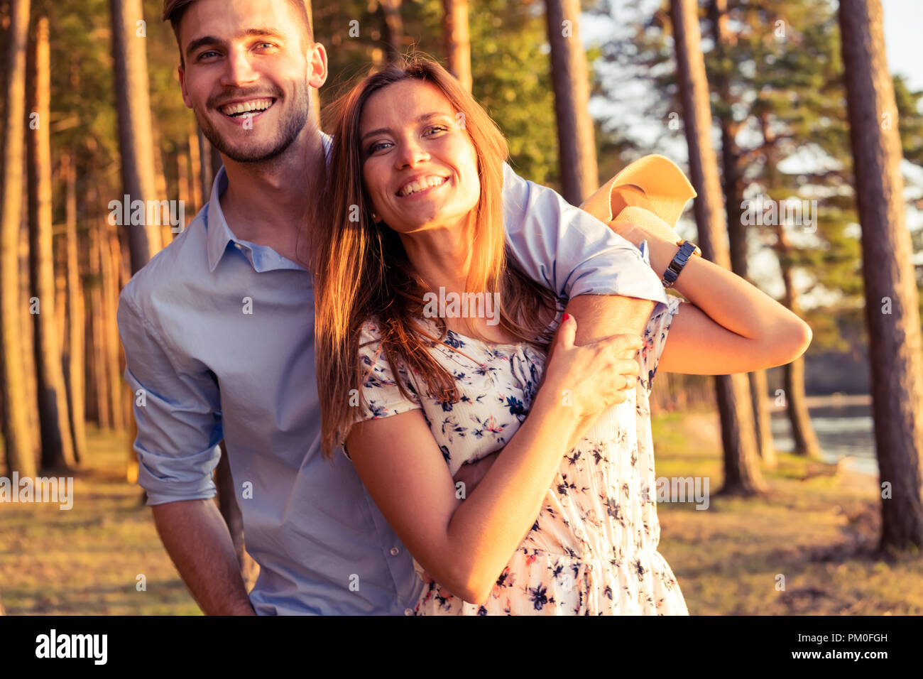 Happy couple in love having fun outdoors and smiling Stock Photo - Alamy
