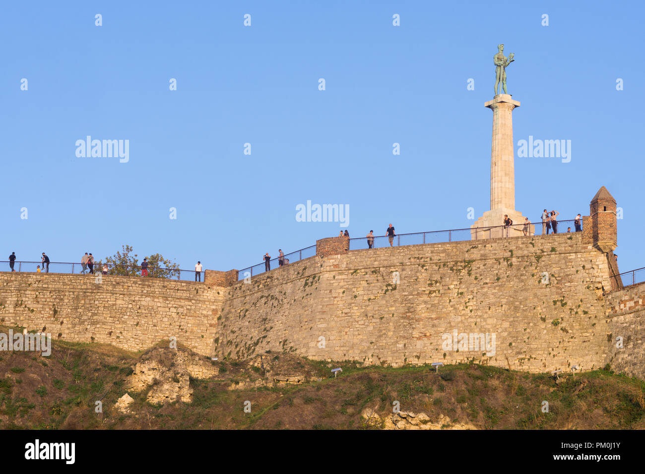 Outer defense walls of the Belgrade fortress Kalemegdan with the statue of Victor, symbol of the city. Serbia. Stock Photo