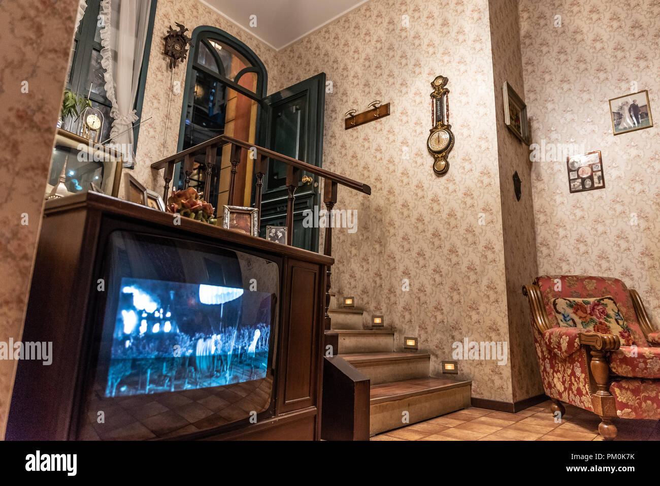 Interior of a fifties house, wooden details and wallpaper on the walls, vertical image Stock Photo