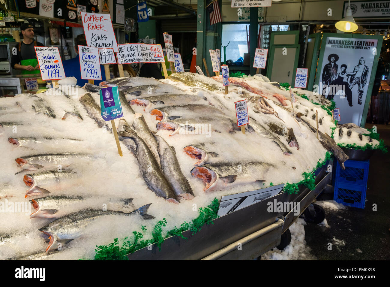 Fresh wild salmons covered with ice displayed on a fish shop stall at Pike Place Market, Seattle, USA. Stock Photo