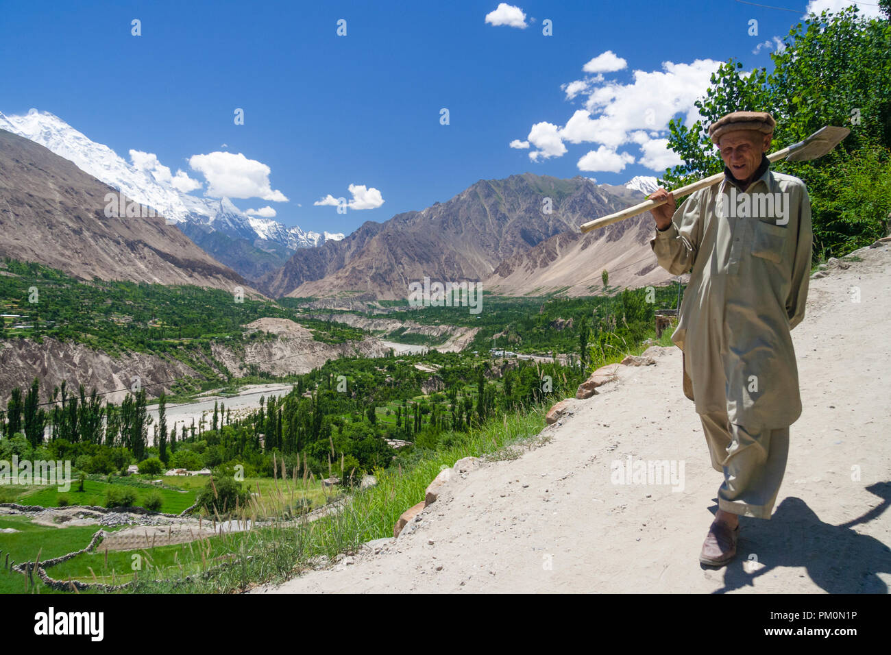 Karimabad, Hunza Valley, Gilgit-Baltistan, Pakistan : A man walks outside the mountain town of Karimabad (formerly Baltit) the capital of the Hunza Va Stock Photo
