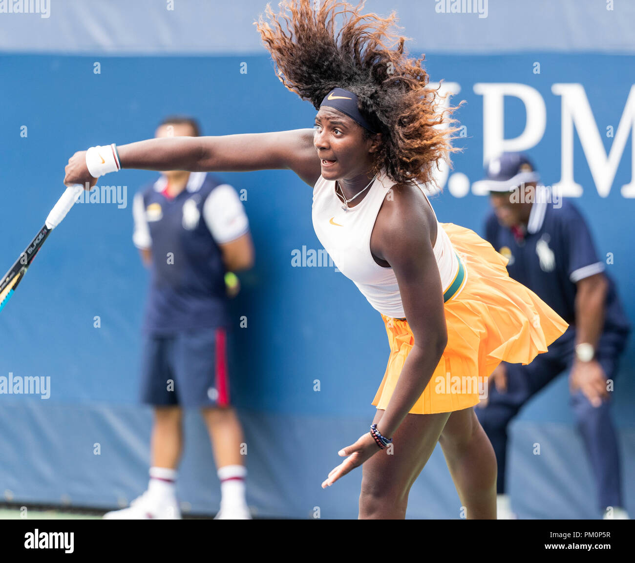 New York, NY - September 2, 2018: Hailey Baptiste of USA serves against Ana Makatsaria of Georgia during 1st round of Girls' Singles at US Open Championships on USTA Billie Jean King National Tennis Center Stock Photo