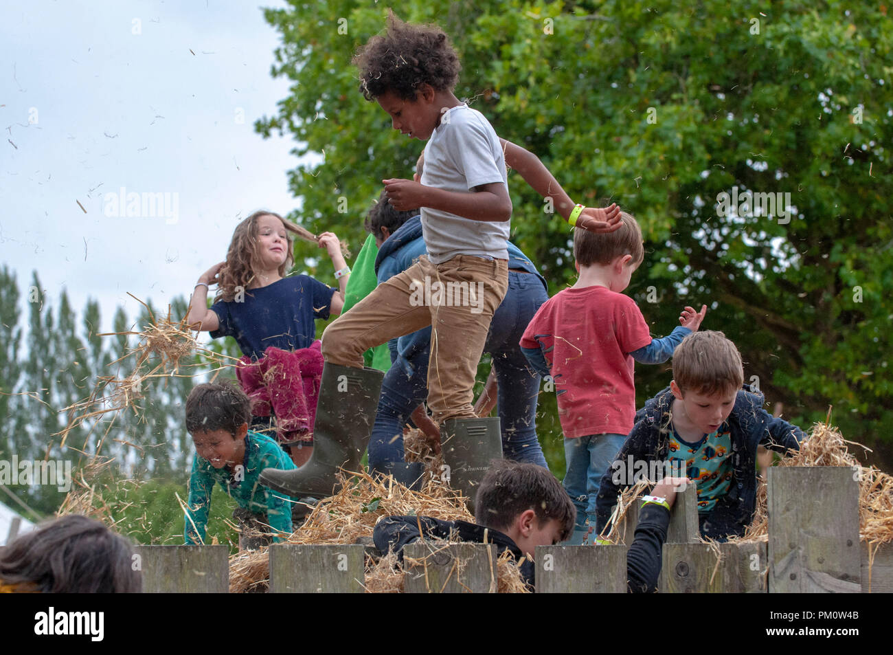 Deeside, UK. 15th Sept 2018.   Children enjoying a hay fight at The Good Life Experience in Hawarden, Cheshire got underway today (Friday). The festival  is billed as a weekend of discovery, adventure, music, food, books, ideassand workshops for the whole family.  Picture by Brian Hickey/Alamy Live News Stock Photo