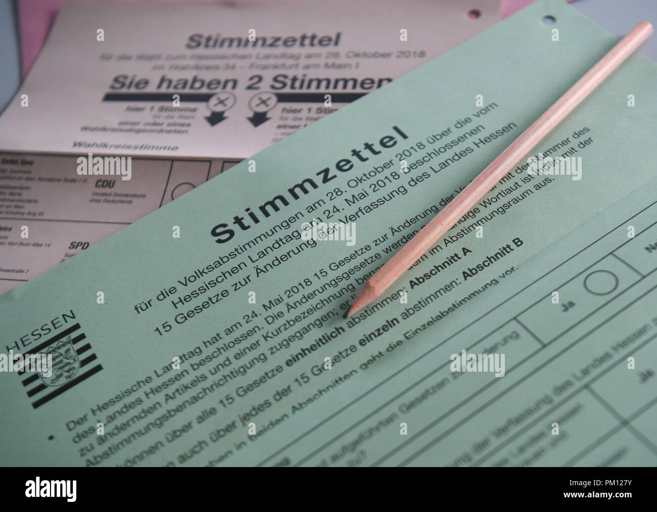 14 September 2018, Hessen, Frankfurt/Main: ILLUSTRATION - 14 September 2018, Germany, Frankfurt/Main: Voting papers for the state elections in Hesse and for the referendum on amendments and supplements to the state constitution are on one table in the Frankfurt electoral office. About six weeks before the state elections in Hesse, particularly hasty voters will be able to cast their votes from 17 September 2018. From this day on, the documents are available for postal voting at the municipal electoral offices. (on dpa 'Voting on the Hessian state election begins with postal vote' of 16.09.2018 Stock Photo