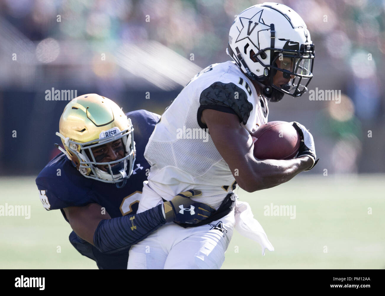 South Bend, Indiana, USA. 15th Sep, 2018. Notre Dame defensive back Houston Griffith (3) makes the tackle on Vanderbilt wide receiver Kalija Lipscomb (16) during NCAA football game action between the Vanderbilt Commodores and the Notre Dame Fighting Irish at Notre Dame Stadium in South Bend, Indiana. Notre Dame defeated Vanderbilt 22-17. John Mersits/CSM/Alamy Live News Stock Photo