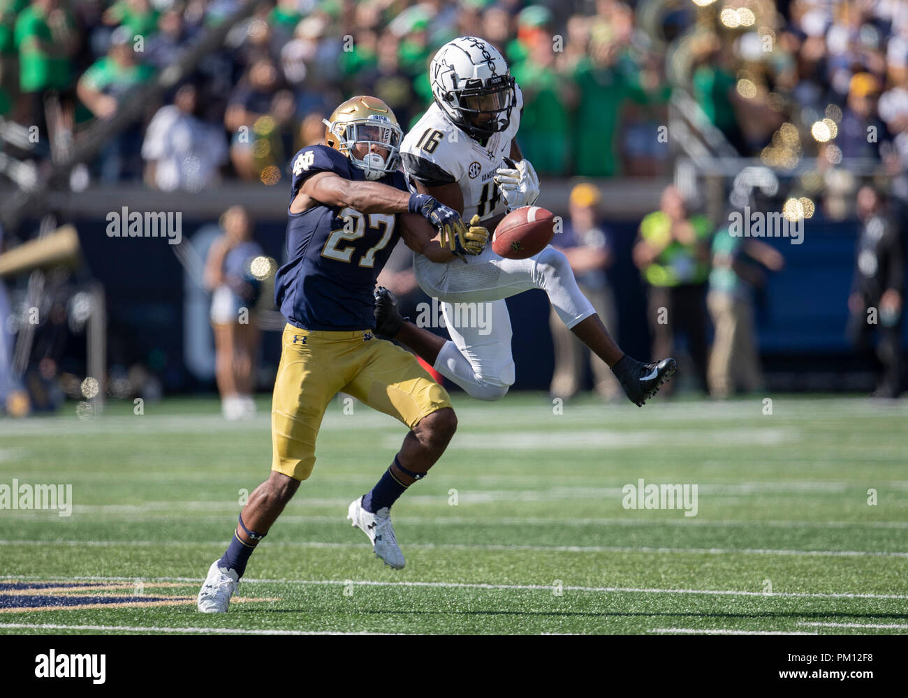 South Bend, Indiana, USA. 15th Sep, 2018. Notre Dame defensive back Julian Love (27) breaks up pass intended for Vanderbilt wide receiver Kalija Lipscomb (16) during NCAA football game action between the Vanderbilt Commodores and the Notre Dame Fighting Irish at Notre Dame Stadium in South Bend, Indiana. Notre Dame defeated Vanderbilt 22-17. John Mersits/CSM/Alamy Live News Stock Photo