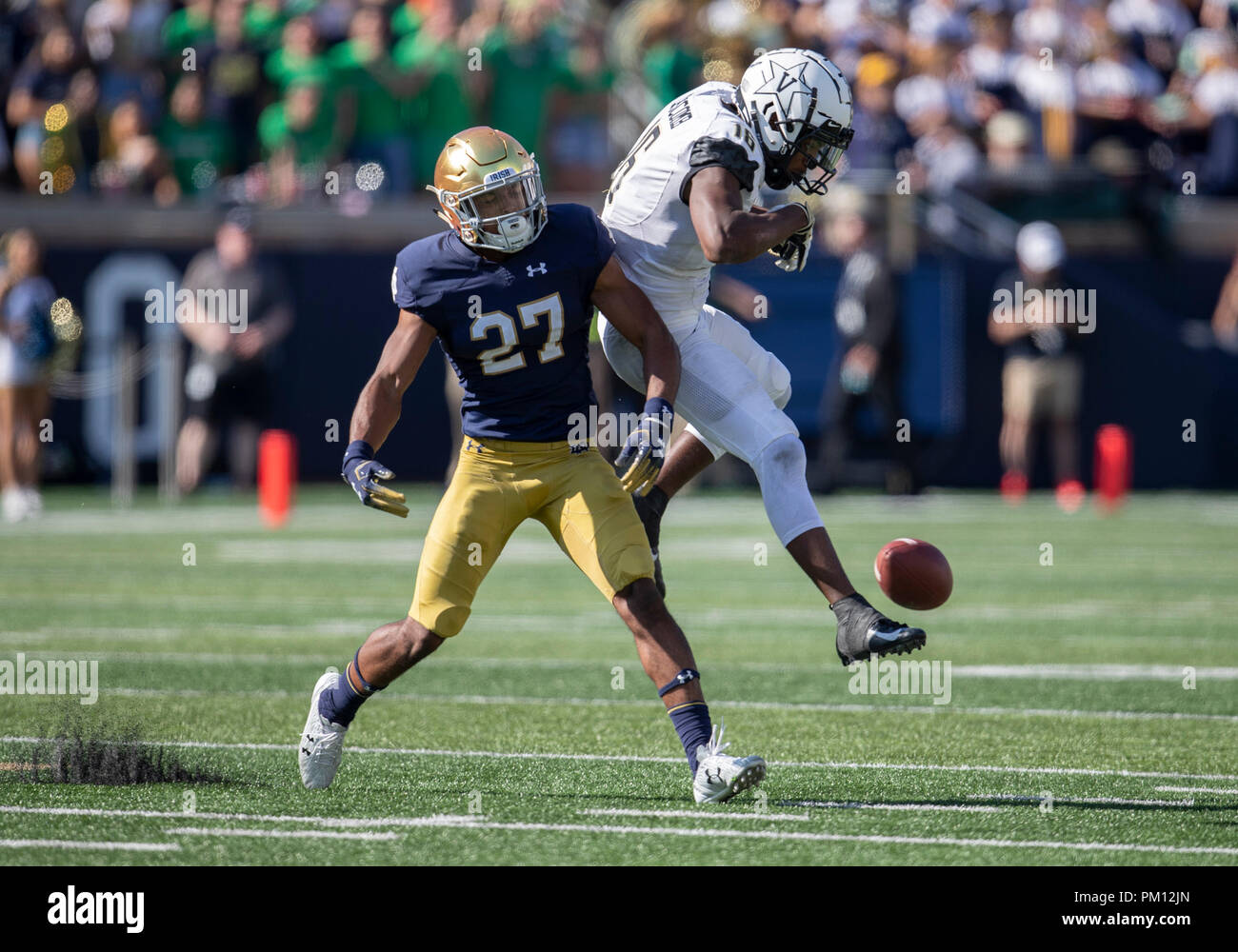 South Bend, Indiana, USA. 15th Sep, 2018. Notre Dame defensive back Julian Love (27) breaks up pass intended for Vanderbilt wide receiver Kalija Lipscomb (16) during NCAA football game action between the Vanderbilt Commodores and the Notre Dame Fighting Irish at Notre Dame Stadium in South Bend, Indiana. Notre Dame defeated Vanderbilt 22-17. John Mersits/CSM/Alamy Live News Stock Photo