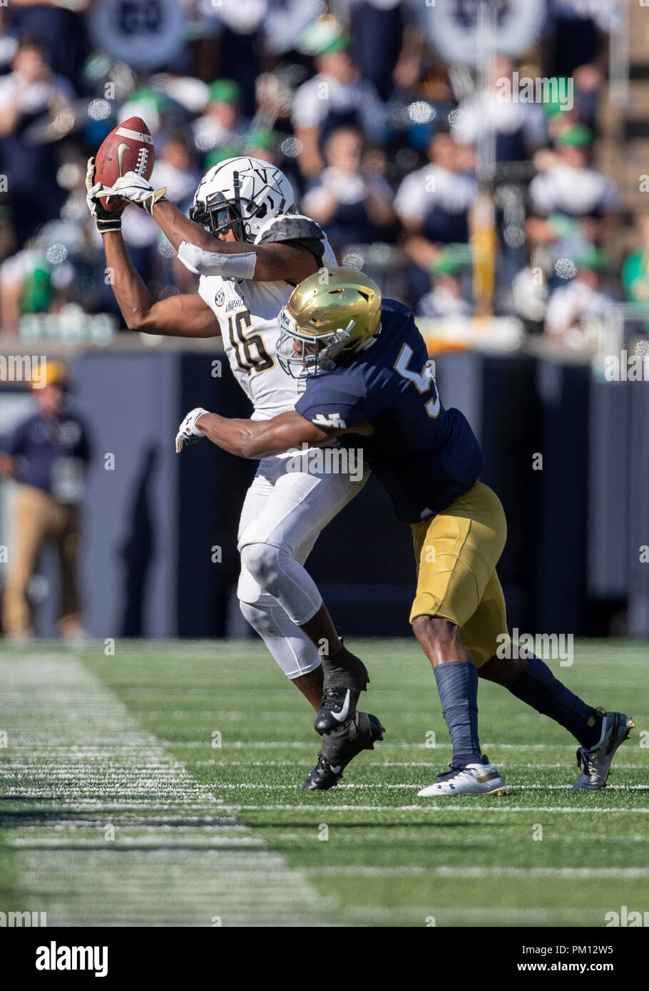South Bend, Indiana, USA. 15th Sep, 2018. Vanderbilt wide receiver Kalija Lipscomb (16) makes the catch as Notre Dame defensive back Troy Pride Jr. (5) defends during NCAA football game action between the Vanderbilt Commodores and the Notre Dame Fighting Irish at Notre Dame Stadium in South Bend, Indiana. Notre Dame defeated Vanderbilt 22-17. John Mersits/CSM/Alamy Live News Stock Photo