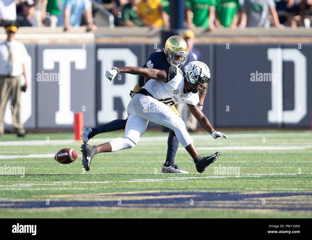 South Bend, Indiana, USA. 15th Sep, 2018. Notre Dame defensive back Troy Pride Jr. (5) defends pass intended for Vanderbilt wide receiver Kalija Lipscomb (16) during NCAA football game action between the Vanderbilt Commodores and the Notre Dame Fighting Irish at Notre Dame Stadium in South Bend, Indiana. Notre Dame defeated Vanderbilt 22-17. John Mersits/CSM/Alamy Live News Stock Photo