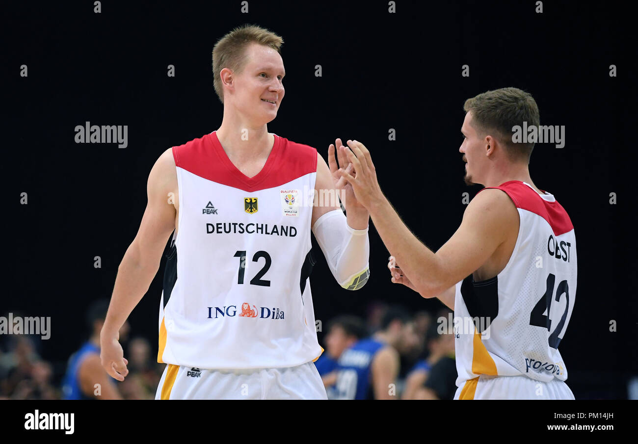 Leipzig, Saxony. 16th Sep, 2018. Basketball: World Cup Qualification,  Germany vs Israel, Round 2, Group L, Day 2 at the Arena Leipzig. Germany's  Robin Benzing (L) and Andreas Obst celebrating their victory