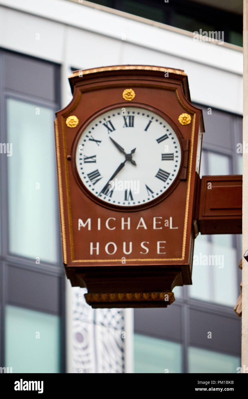 A clock outside Michael House, the Marks and Spencer store on Oxford Street Stock Photo