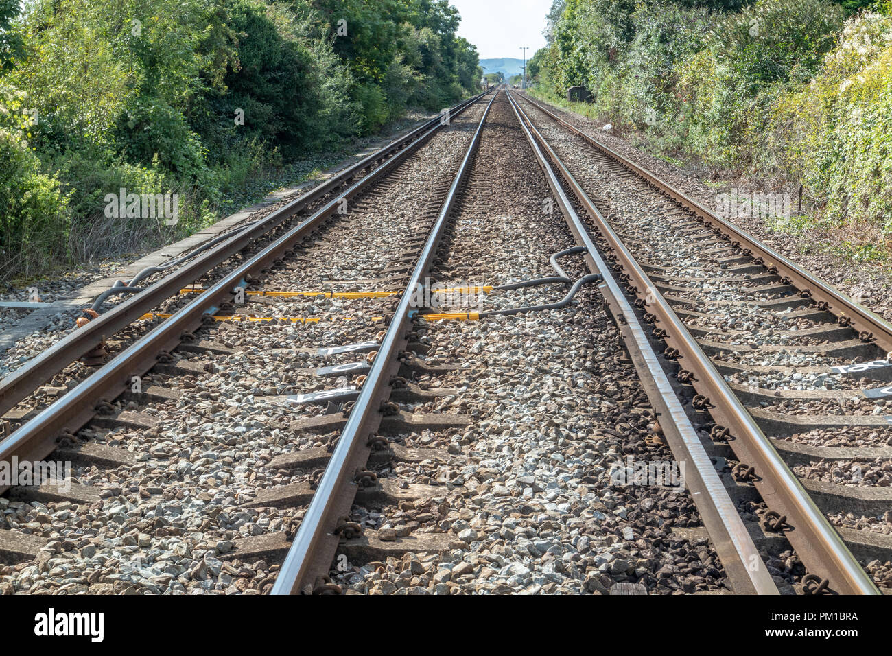 Railway tracks, showing the third rail system as used in the south of the England. Stock Photo
