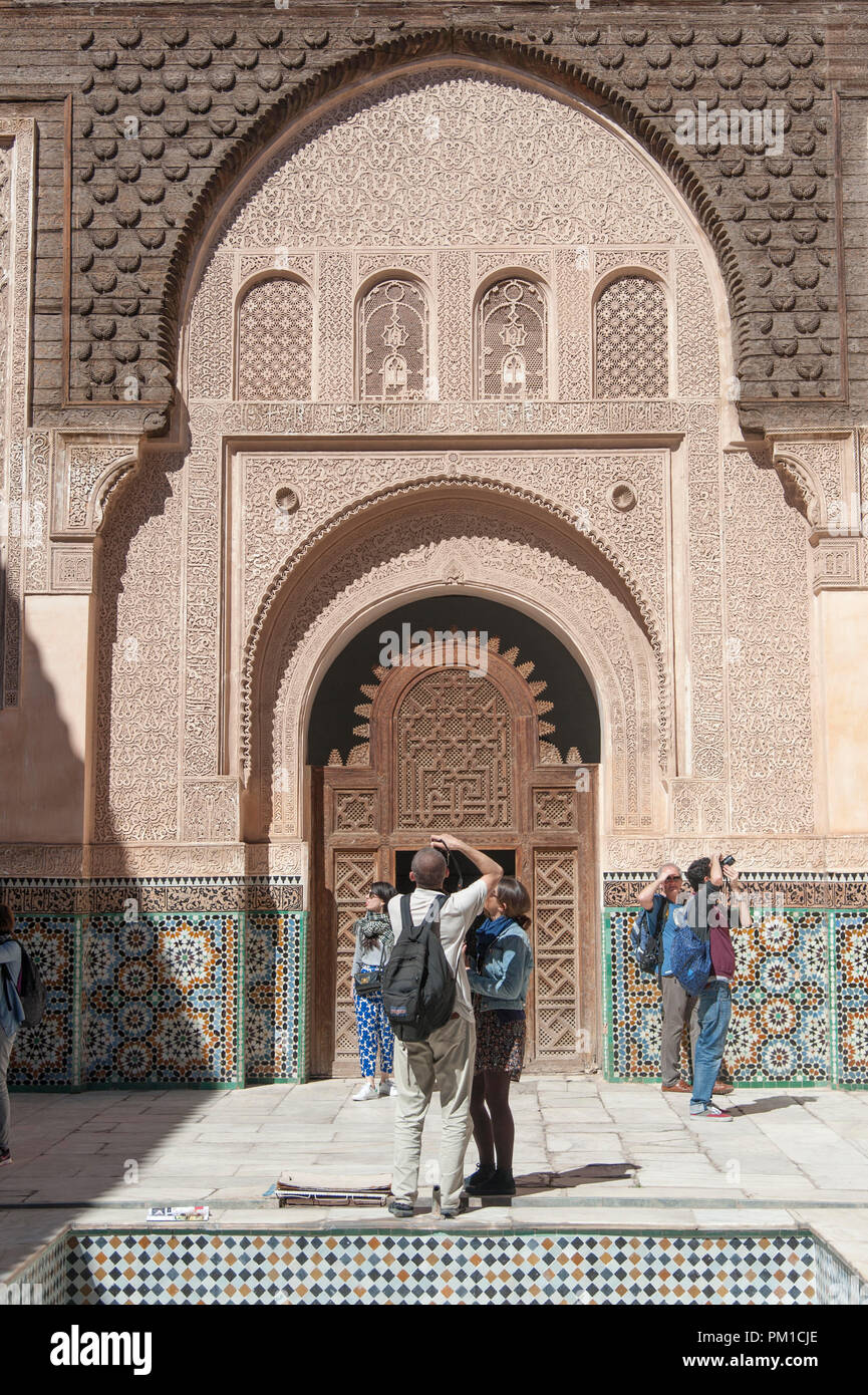 26-02-15, Marrakech, Morocco. Tourists taking photographs at the Medersa Ben Youssef, or The son of Joseph School. Photo © Simon Grosset Stock Photo