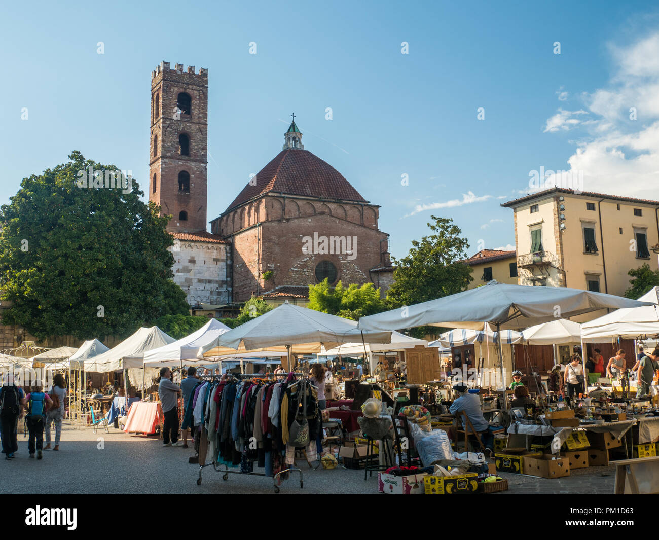 Piazza Antelminelli with the Church of Saint John (Giovanni) & Reparata, on a market day in the walled city of Lucca, Tuscany, Italy Stock Photo