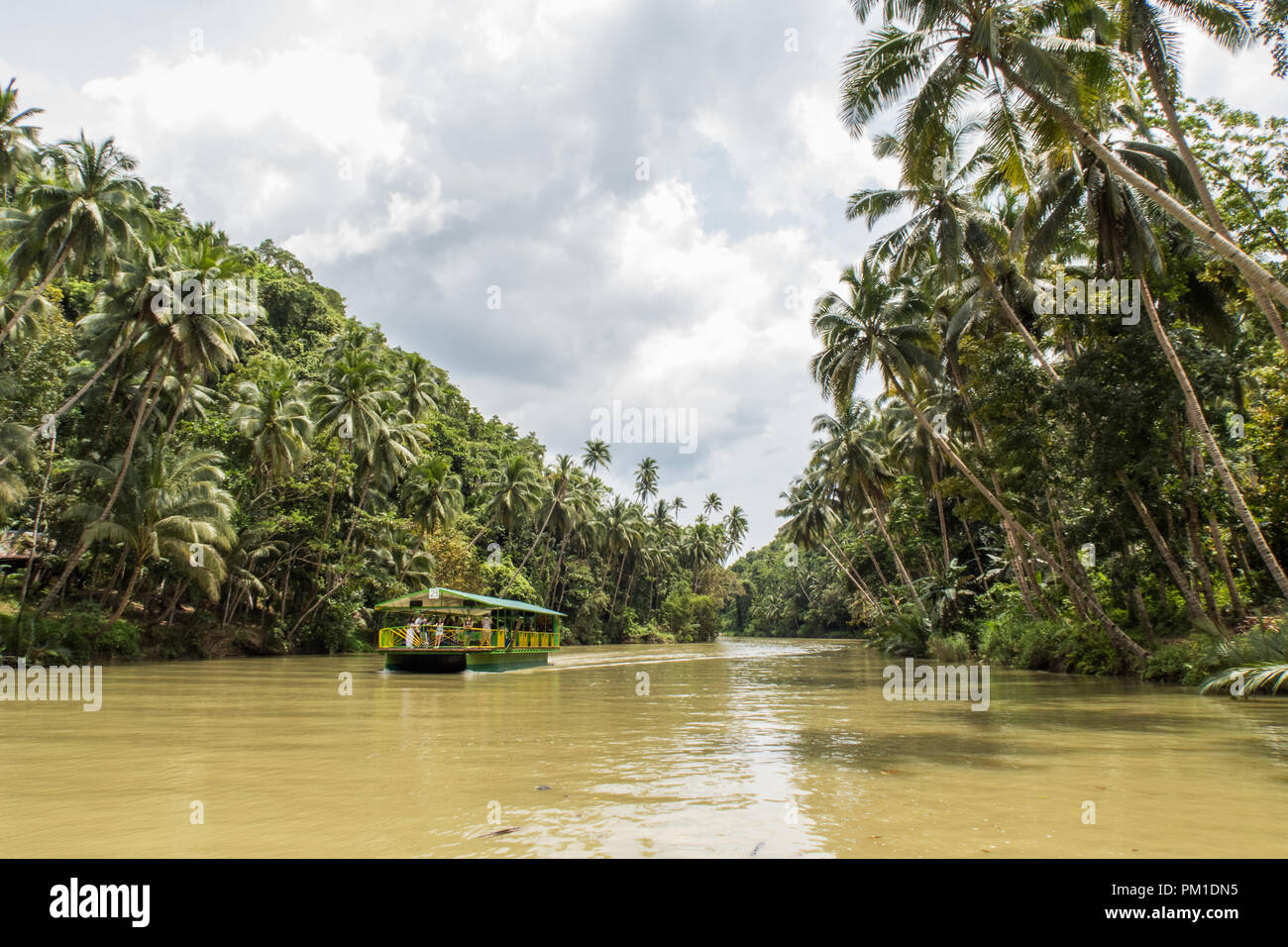 A Floating Restaraunt boat floats down the river Loboc. Taken during a