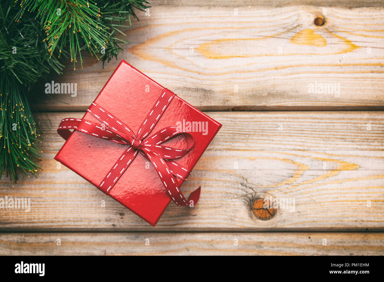 christmas gift box with red ribbon on wooden background copy space top view - Wooden Box Christmas Decorations christmas gift box with red ribbon on wooden background copy space top view - Wooden Box Christmas Decorations