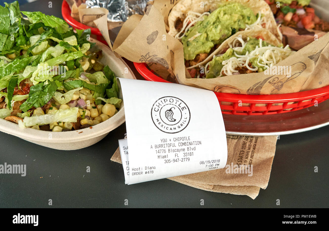 MIAMI, USA - AUGUST 22, 2018: Chipotle plate and receipt. Chipotle restaurant logo. Chipotle Mexican Grill is an American chain of fast casual restaur Stock Photo