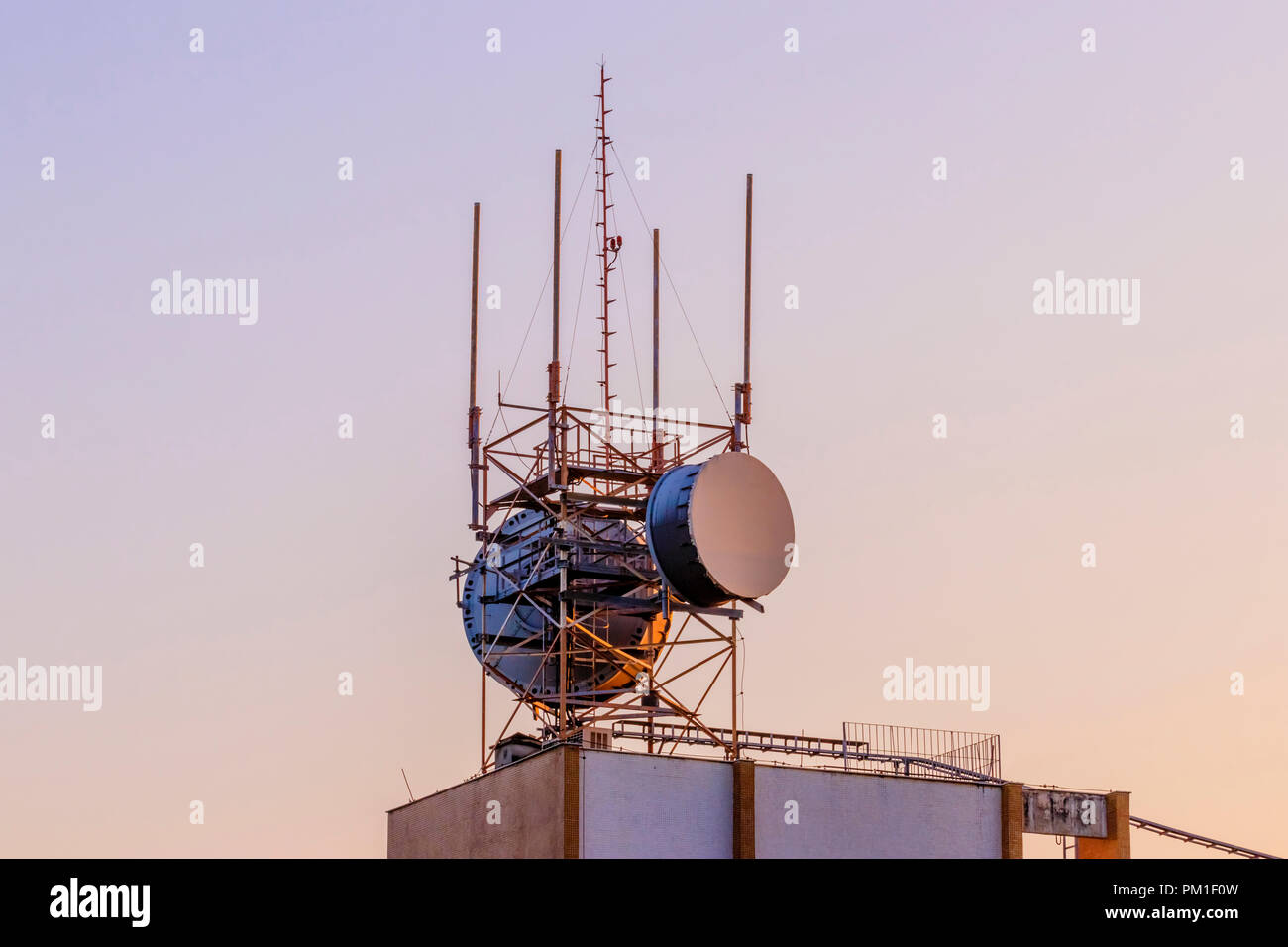 Radio antennas under the colorful sunset sky Stock Photo