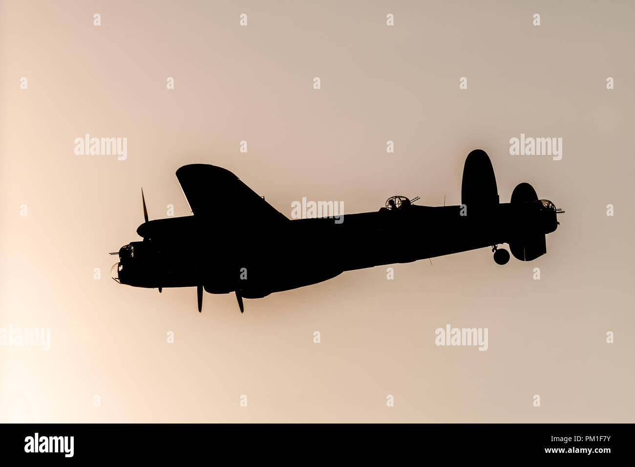 SOUTHPORT, UK JULY 8 2018:  A photograph documenting the silhouette of the Avro Lancaster Bomber from the Battle of Britain Memorial Flight as it perf Stock Photo