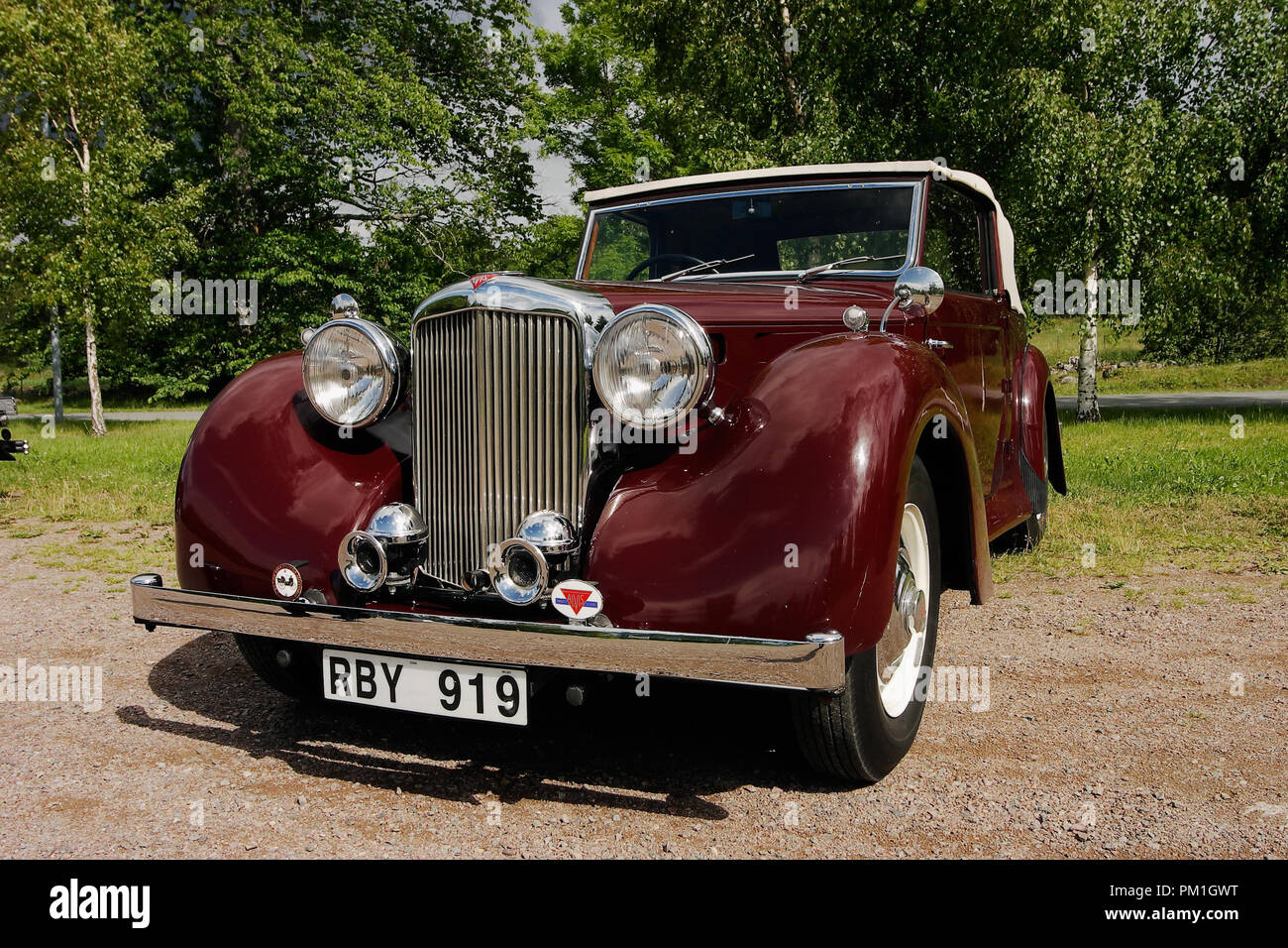 Rottle, Sweden - July 4, 2004: Front view of a wine red 1949 Alvis Ta 14 drophead cabriolet. Stock Photo