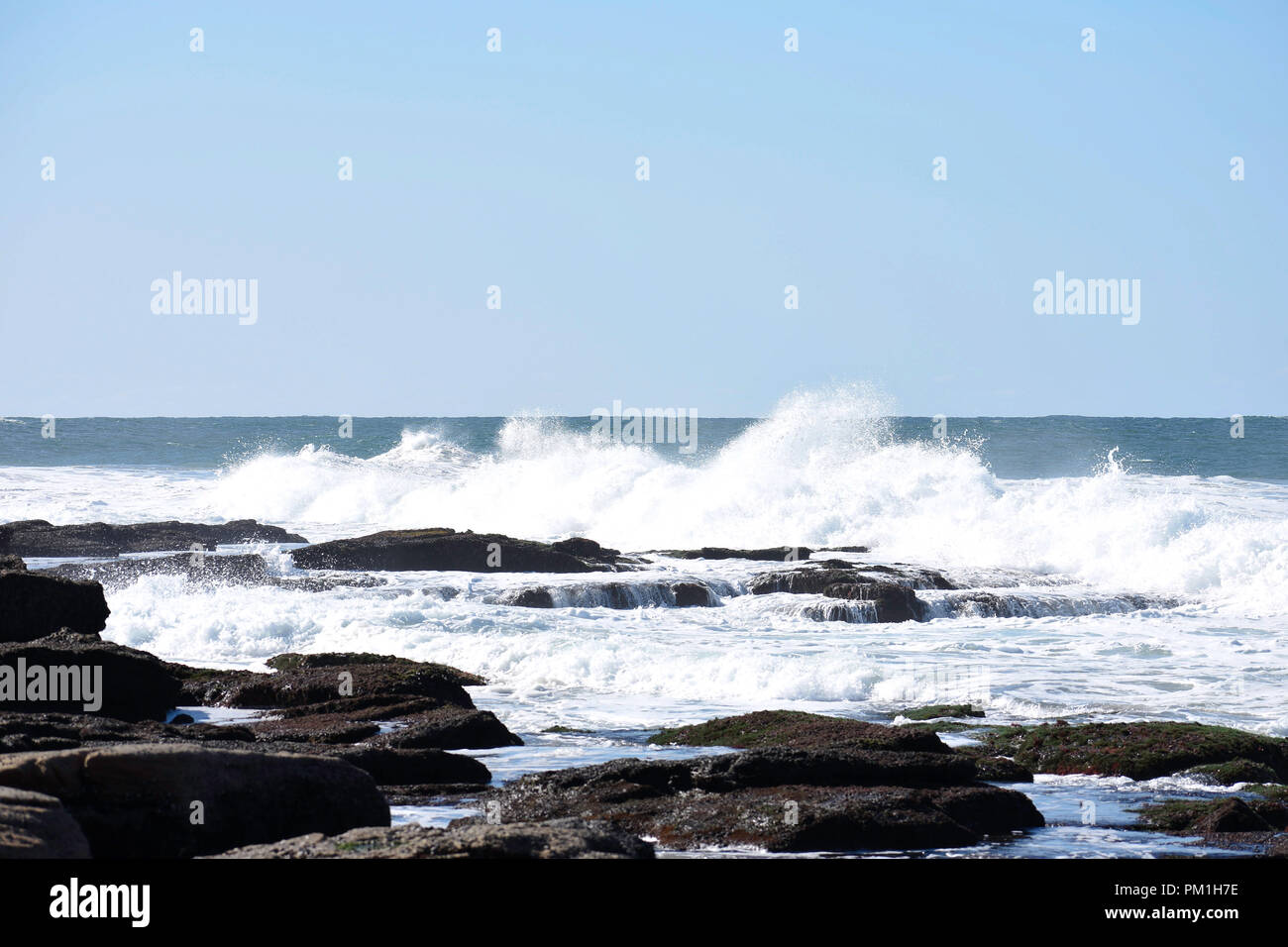 Waves Crashing Into Rock Pools As The Tide Comes In, Uvongo, South Africa Stock Photo