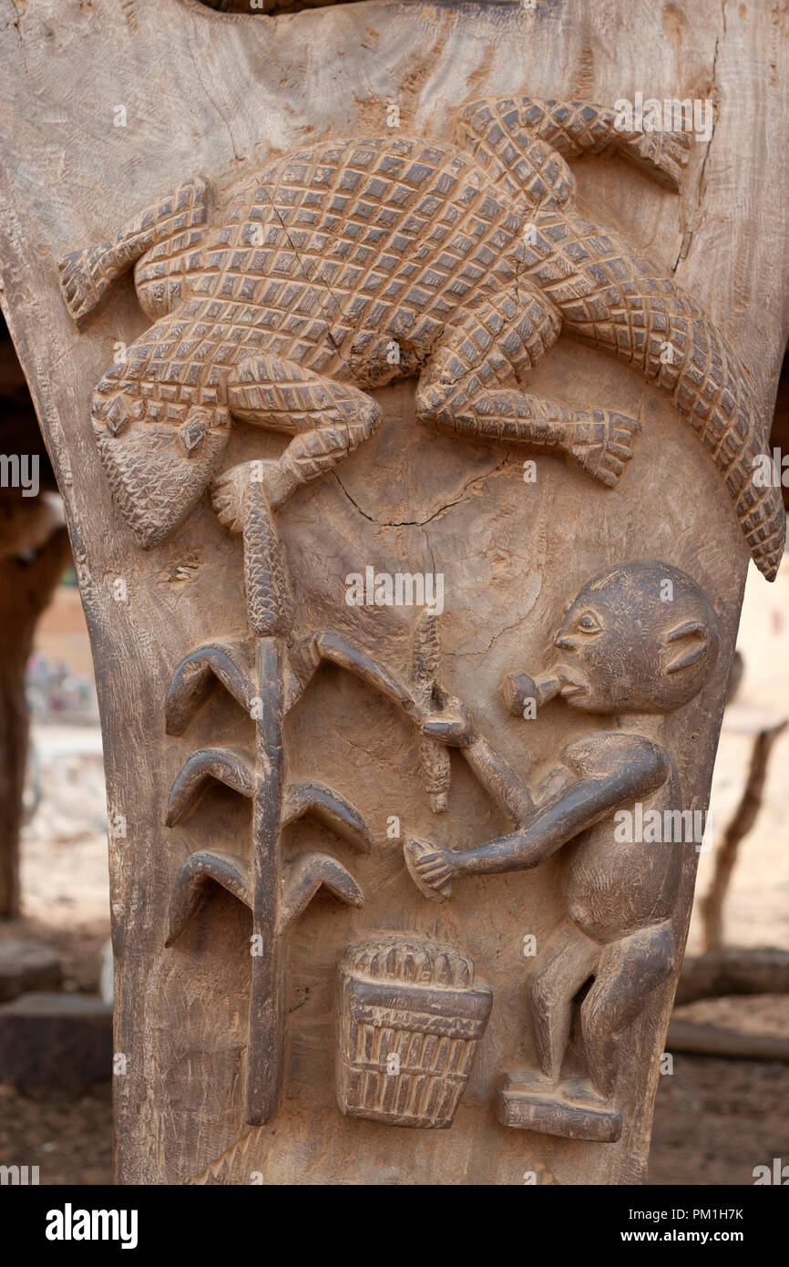 Dogon wooden sculpture on a "toguna" (or palaver hut) pillar. The sculpture represents a