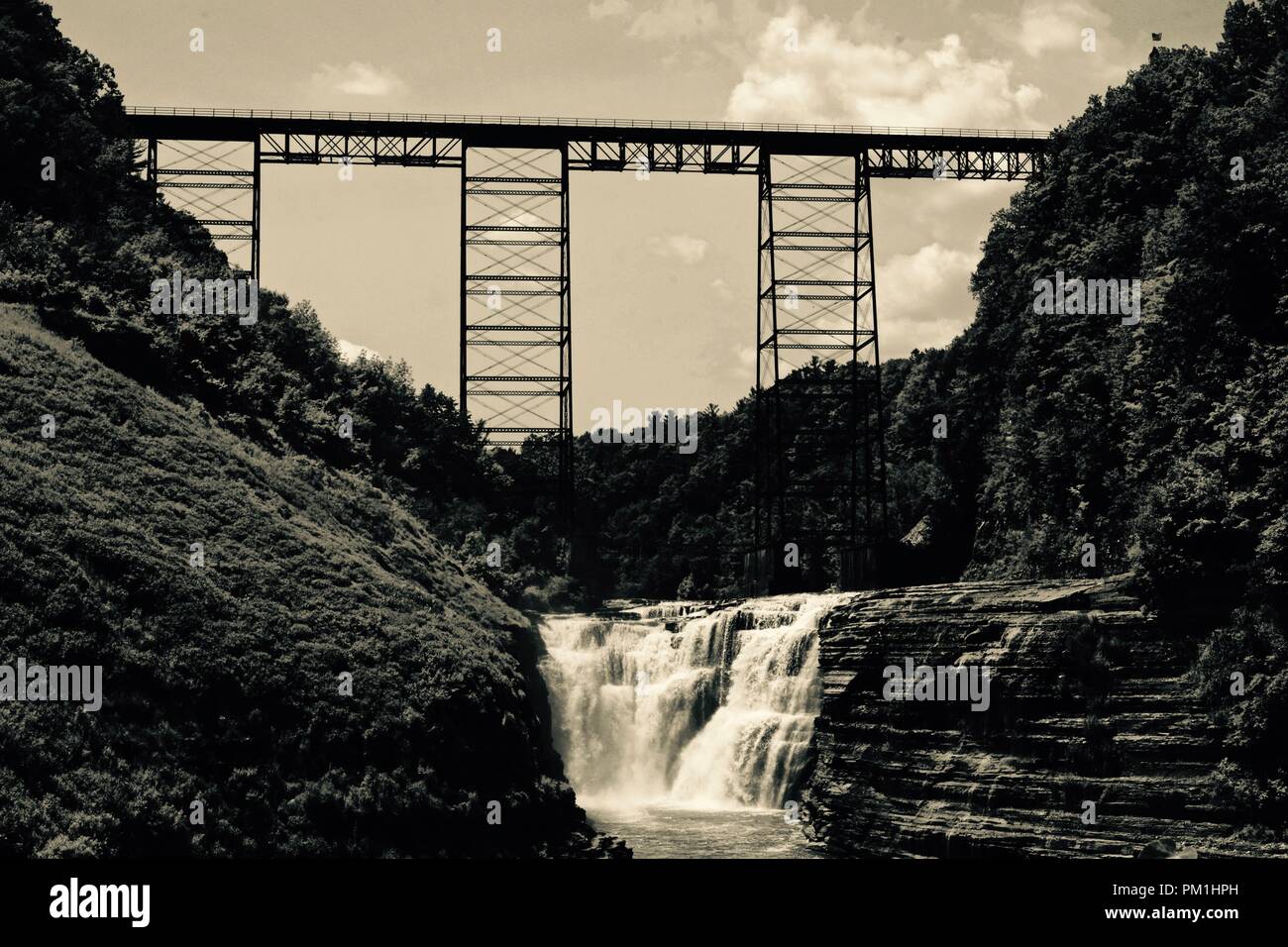 sepia waterfall and bridge landscape Stock Photo
