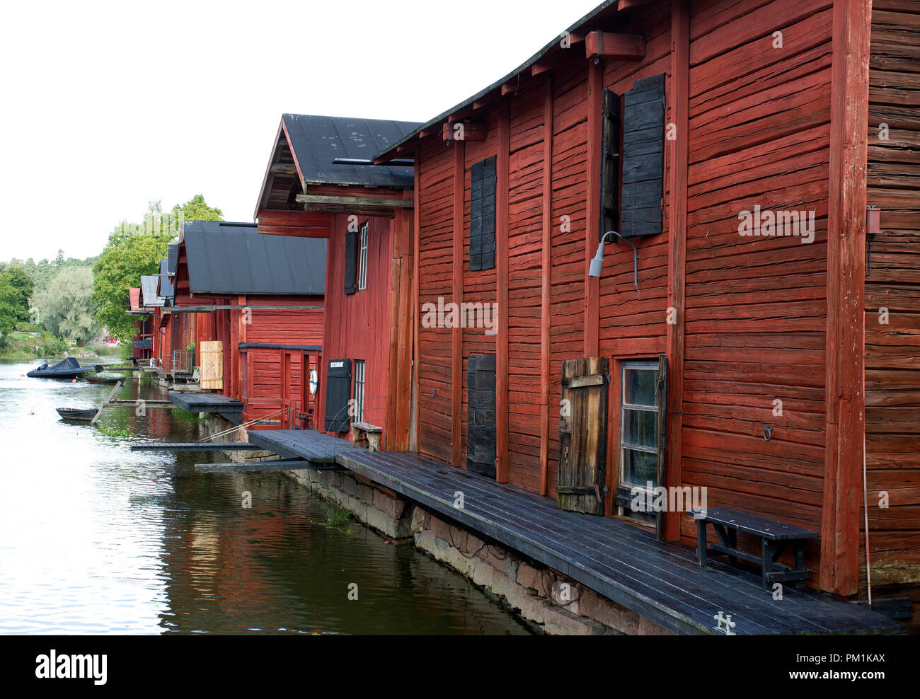Very Old Wooden Red Warehouses along river in Porvoo Finland Stock Photo