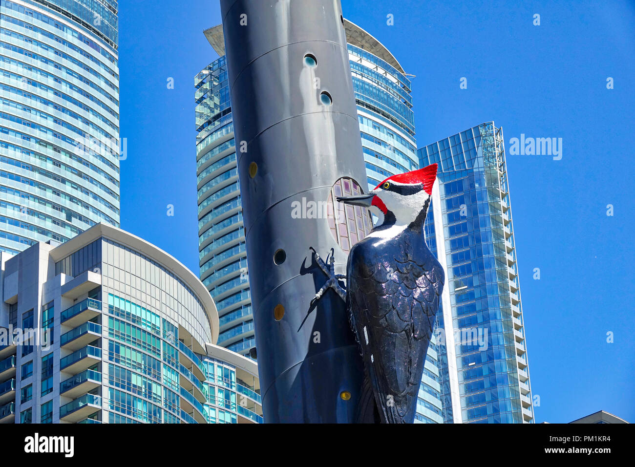 Toronto, Canada – 20 June, 2018: Sculpture of woodpecker on pole at Metro Toronto Convention Center Stock Photo