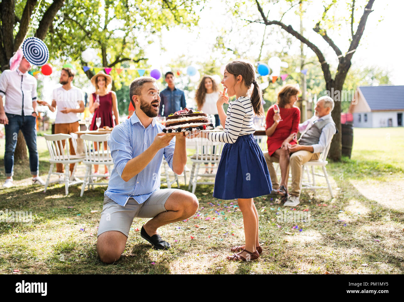 father giving a cake