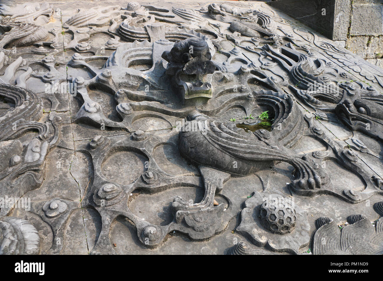 A relief dragon carved in stone Stock Photo