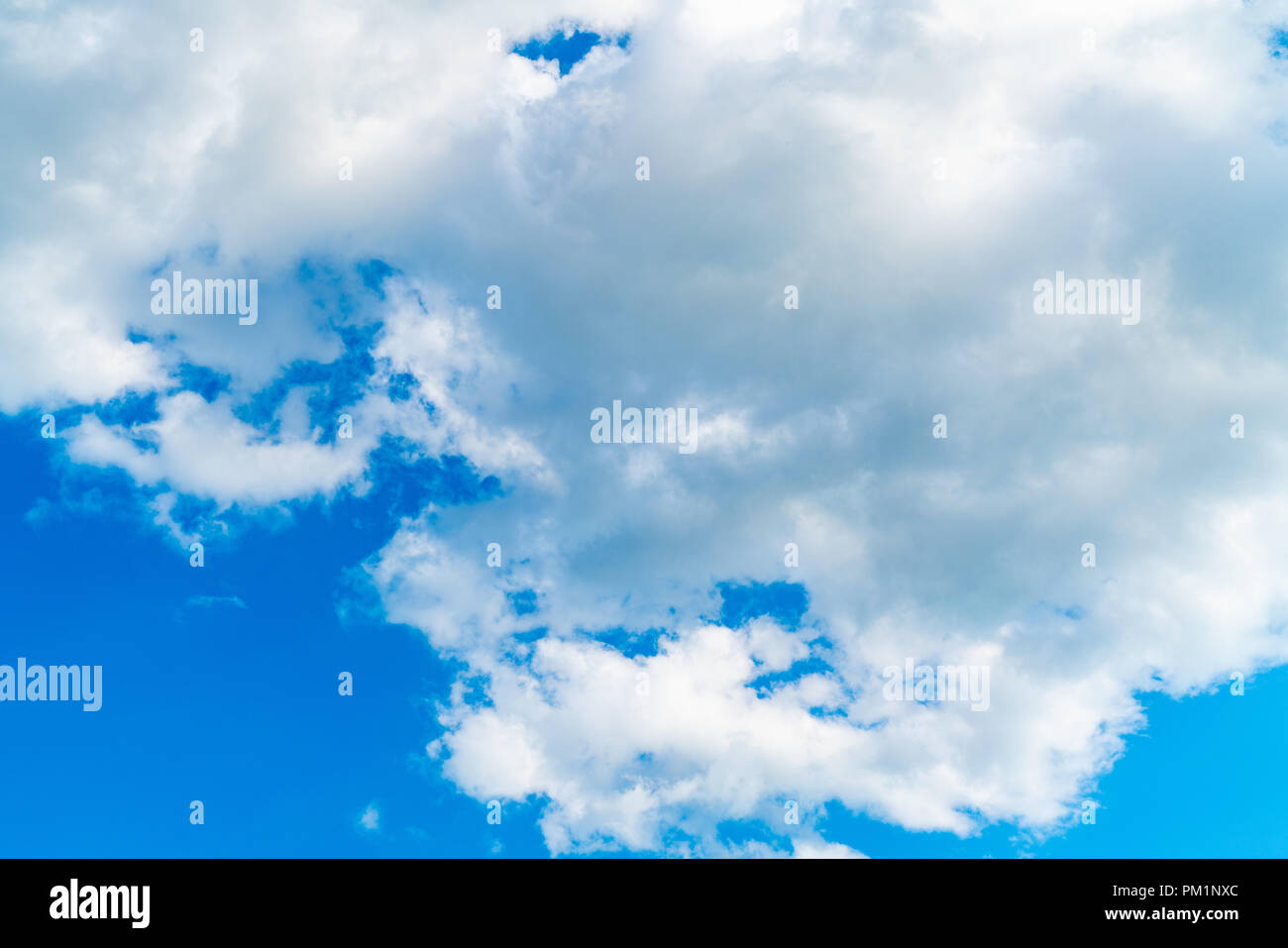 Light blue sky with big white clouds Stock Photo - Alamy