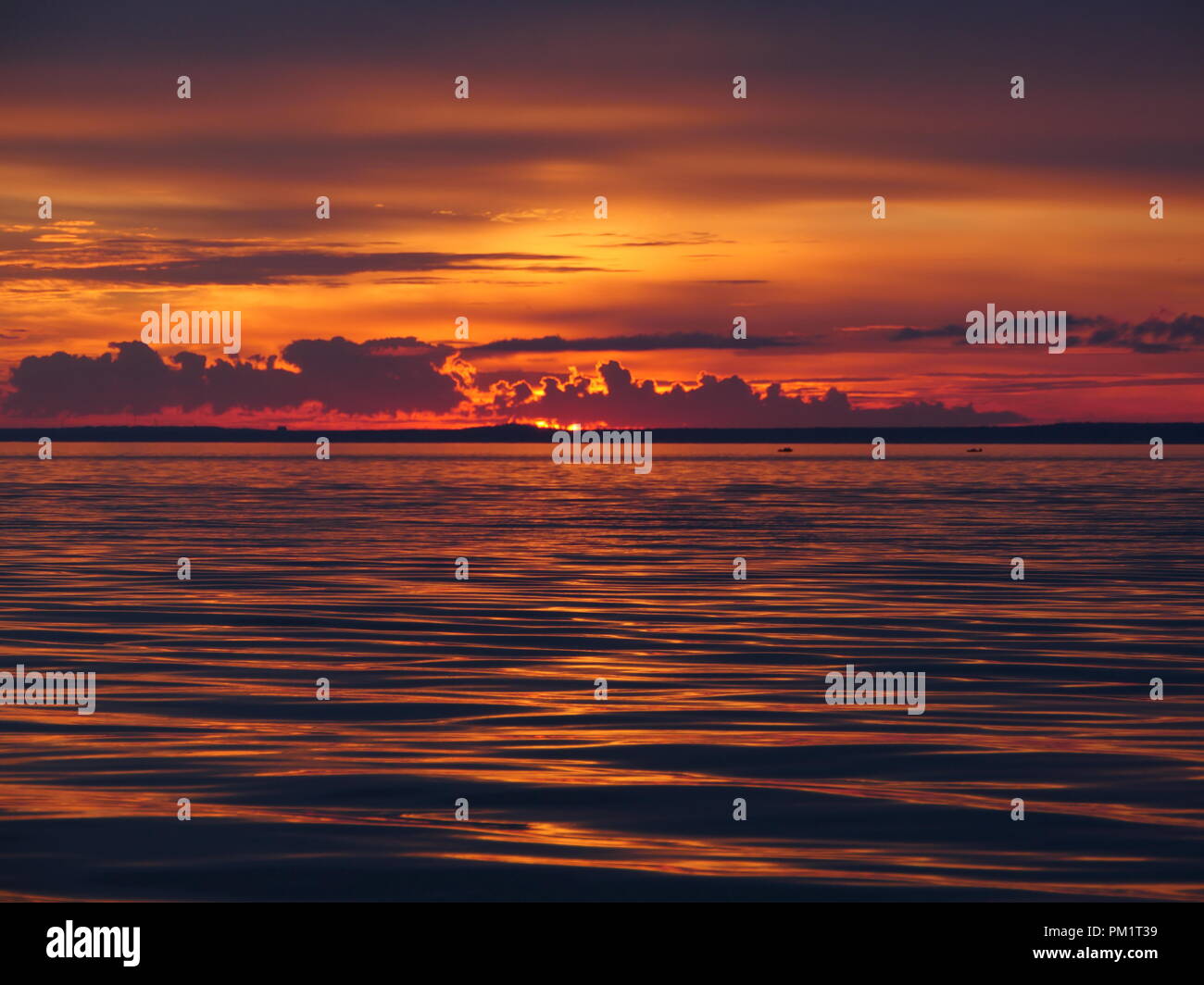 dramatic red sunset on the sea Stock Photo