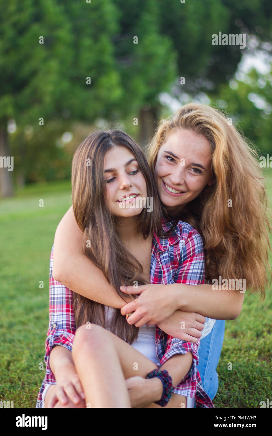 Young women enjoying and laughing in the park on a sunny day Stock ...