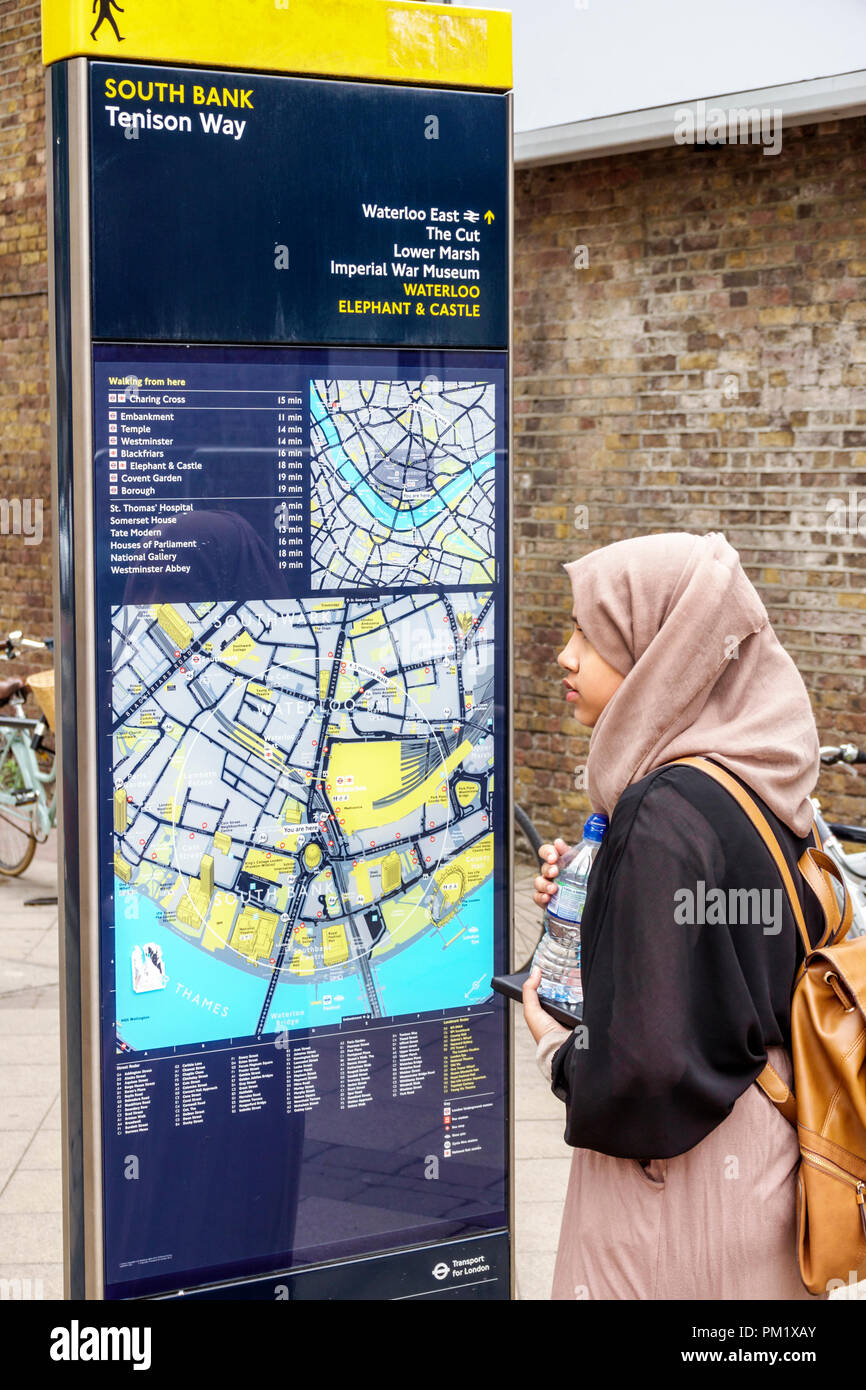 London England,UK,South Bank,Tenison Way,Legible London Wayfaring sign,on street pedestrian map,directions,woman female women,Muslim,hijab,head coveri Stock Photo
