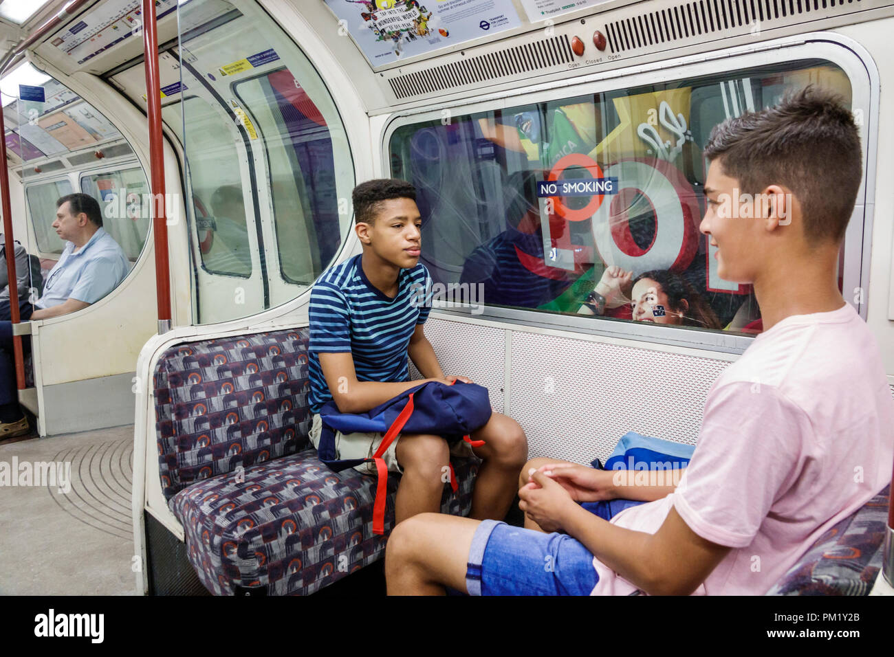 London England,UK,South Bank,Lambeth North Underground Station train Tube subway tube,train,inside interior,Black boy boys,male kid kids child childre Stock Photo